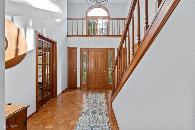 5011 Buttonbush Ln, North Royalton, OH 44133 - foyer featuring a high ceiling, baseboards, and stairway