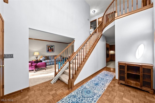 5011 Buttonbush Ln, North Royalton, OH 44133 - staircase with a high ceiling and baseboards