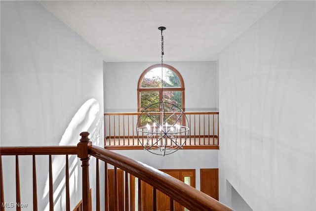 5011 Buttonbush Ln, North Royalton, OH 44133 - corridor featuring a chandelier and an upstairs landing