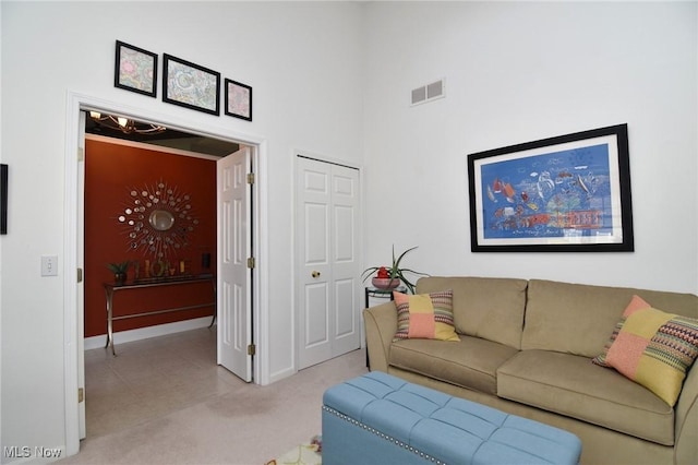 335 Devon Pond, Aurora, OH 44202 - living area with baseboards, a high ceiling, and light colored carpet