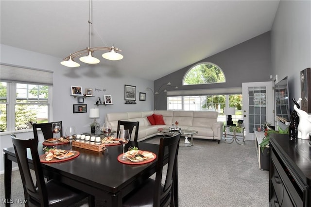 335 Devon Pond, Aurora, OH 44202 - carpeted dining area featuring high vaulted ceiling and baseboards