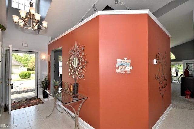 335 Devon Pond, Aurora, OH 44202 - tiled foyer entrance featuring a chandelier, high vaulted ceiling, and baseboards