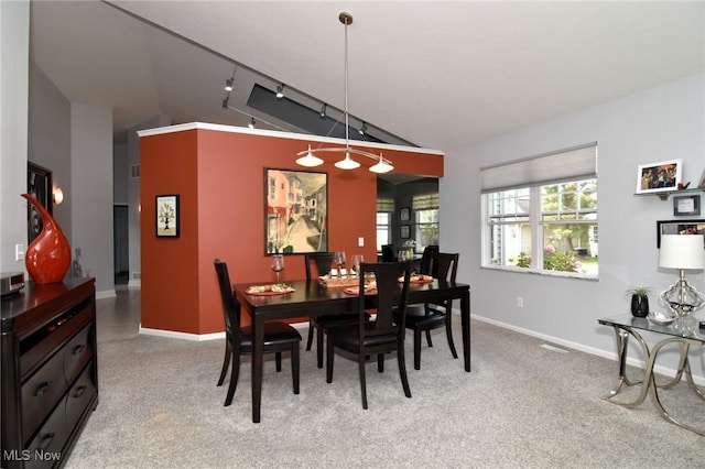 335 Devon Pond, Aurora, OH 44202 - dining space with light colored carpet, baseboards, and high vaulted ceiling