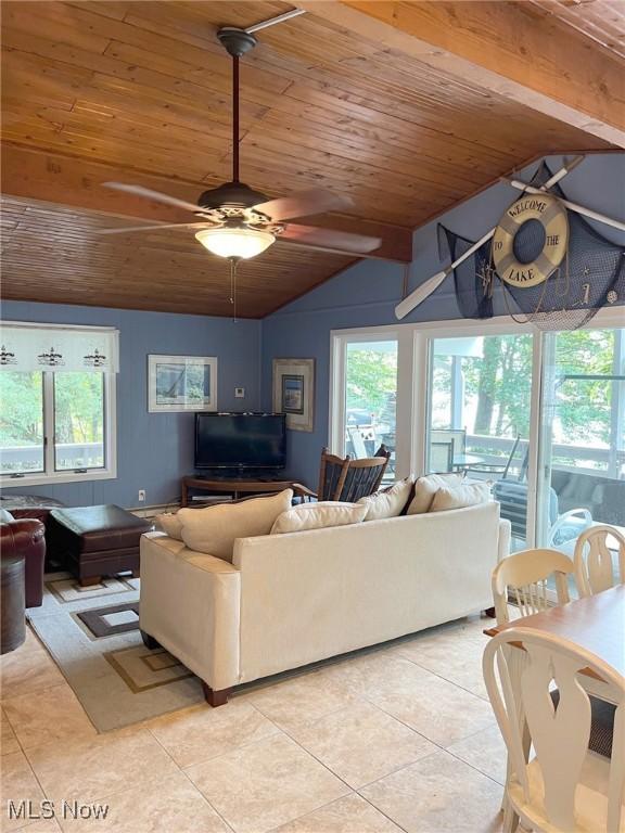 86 Cheyenne Trl, Malvern, OH 44644 - living area featuring wood ceiling, light tile patterned flooring, vaulted ceiling, healthy amount of natural light, and ceiling fan