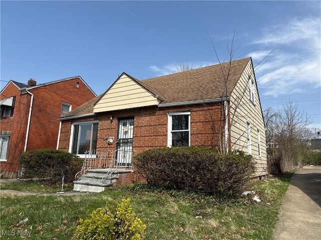 3877 E 153rd St, Cleveland, OH 44128 - bungalow featuring brick siding and roof with shingles