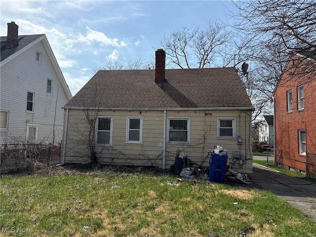 3877 E 153rd St, Cleveland, OH 44128 - back of property featuring a chimney and roof with shingles