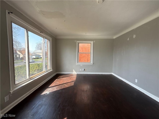 3877 E 153rd St, Cleveland, OH 44128 - empty room with baseboards, dark wood-style flooring, and ornamental molding