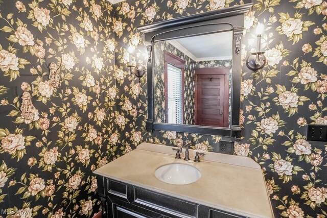 490 N Main St, Magnolia, OH 44643 - bathroom with wallpapered walls, vanity, and crown molding