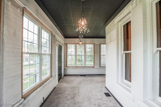 490 N Main St, Magnolia, OH 44643 - unfurnished sunroom with a chandelier
