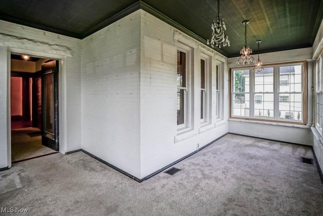 490 N Main St, Magnolia, OH 44643 - unfurnished sunroom with a chandelier