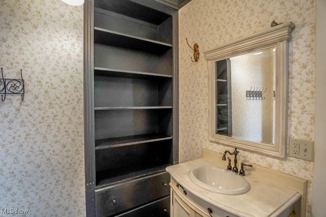 490 N Main St, Magnolia, OH 44643 - bathroom featuring wallpapered walls and vanity