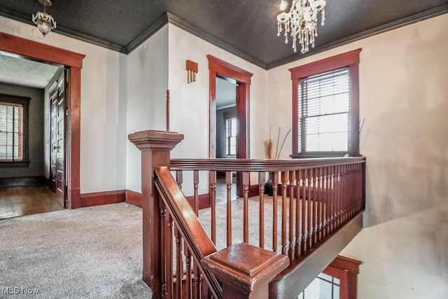 490 N Main St, Magnolia, OH 44643 - stairway with crown molding, a chandelier, plenty of natural light, and baseboards