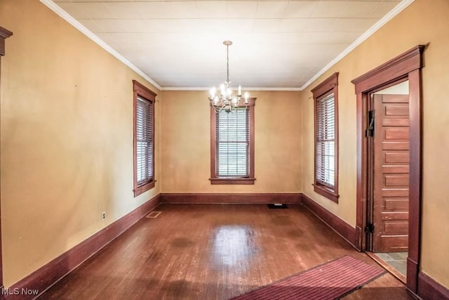 490 N Main St, Magnolia, OH 44643 - unfurnished dining area featuring dark wood-type flooring, a chandelier, baseboards, and ornamental molding