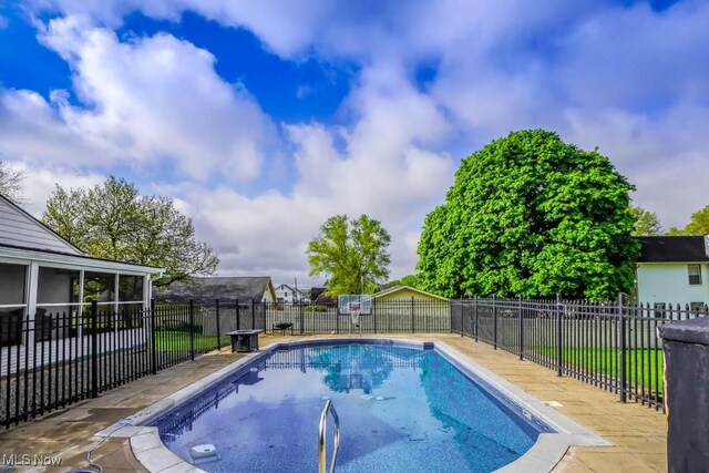 490 N Main St, Magnolia, OH 44643 - view of swimming pool with a sunroom