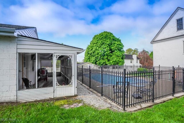490 N Main St, Magnolia, OH 44643 - view of swimming pool featuring a sunroom