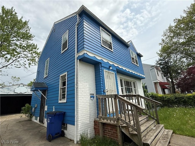 16109 Delrey Ave, Cleveland, OH 44128 - rear view of property featuring brick siding