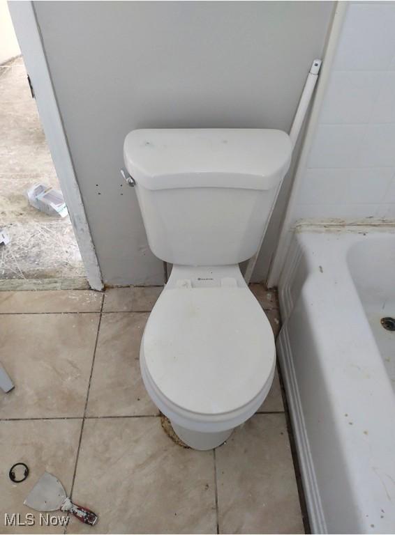 16109 Delrey Ave, Cleveland, OH 44128 - full bathroom with toilet and a tub to relax in