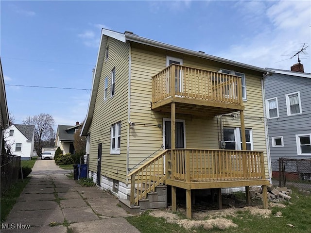 15002 Kingsford Ave, Cleveland, OH 44128 - rear view of property featuring a balcony and a wooden deck