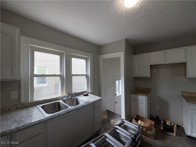 15002 Kingsford Ave, Cleveland, OH 44128 - kitchen with a sink and white cabinetry