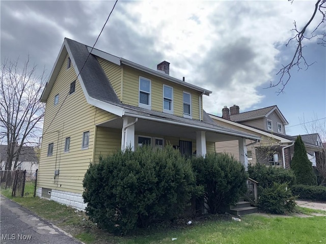 15002 Kingsford Ave, Cleveland, OH 44128 - view of front of house featuring a chimney and covered porch