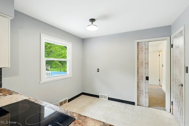 1795 Far View Rd, Green, OH 44312 - unfurnished dining area with tile patterned floors and baseboards