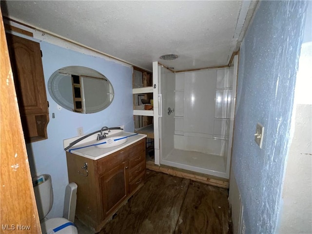 17184 State Route 45, Wellsville, OH 43968 - bathroom featuring vanity, wood finished floors, and a stall shower