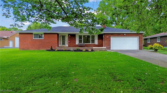 525 Cynthia Dr, Campbell, OH 44405 - ranch-style home with brick siding, an attached garage, driveway, a front lawn, and a chimney