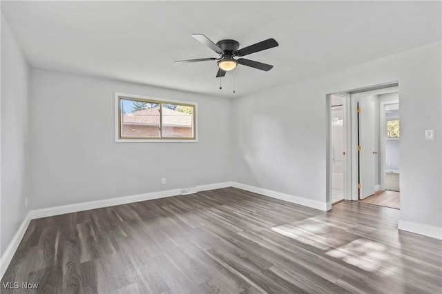 525 Cynthia Dr, Campbell, OH 44405 - spare room featuring plenty of natural light, wood finished floors, and ceiling fan