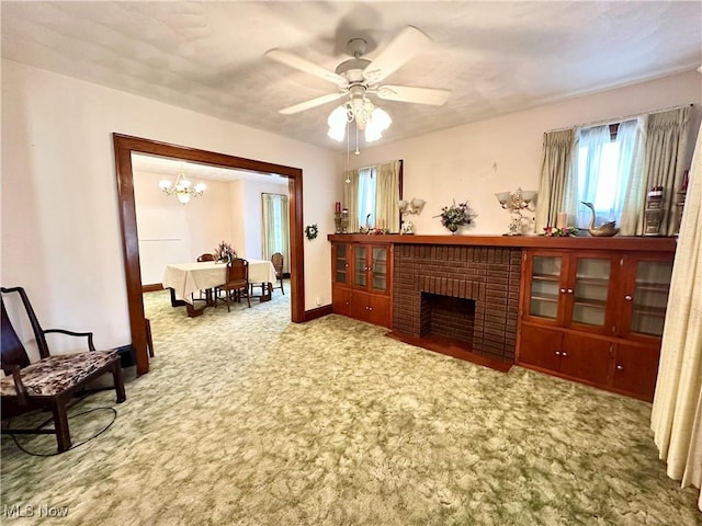 808 Gilbert Ave, Follansbee, WV 26037 - living room featuring a chandelier, carpet flooring, a fireplace, a ceiling fan, and baseboards