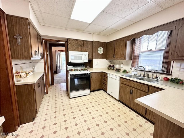 808 Gilbert Ave, Follansbee, WV 26037 - kitchen with white appliances, a sink, light floors, light countertops, and a paneled ceiling