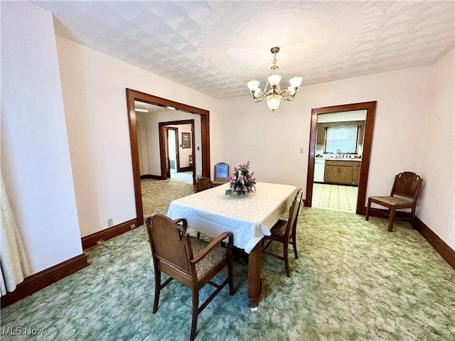 808 Gilbert Ave, Follansbee, WV 26037 - dining space with a chandelier, light carpet, and baseboards