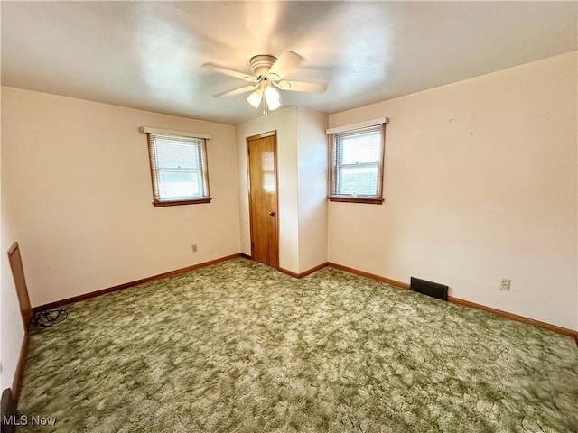 808 Gilbert Ave, Follansbee, WV 26037 - carpeted empty room with plenty of natural light, ceiling fan, and baseboards