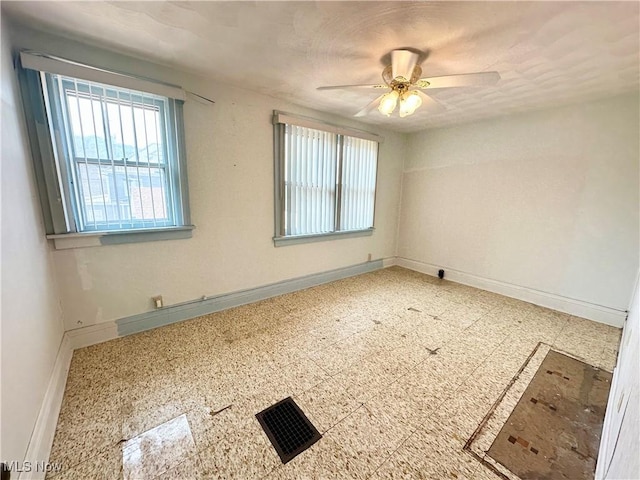 808 Gilbert Ave, Follansbee, WV 26037 - unfurnished room featuring baseboards and a ceiling fan