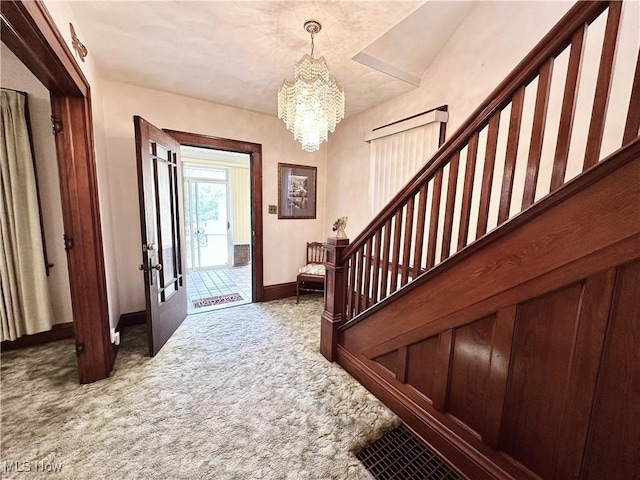 808 Gilbert Ave, Follansbee, WV 26037 - carpeted entrance foyer featuring a chandelier, baseboards, stairway, and french doors