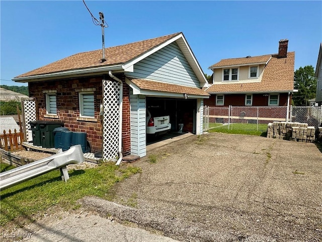 808 Gilbert Ave, Follansbee, WV 26037 - back of property with a garage and a chimney