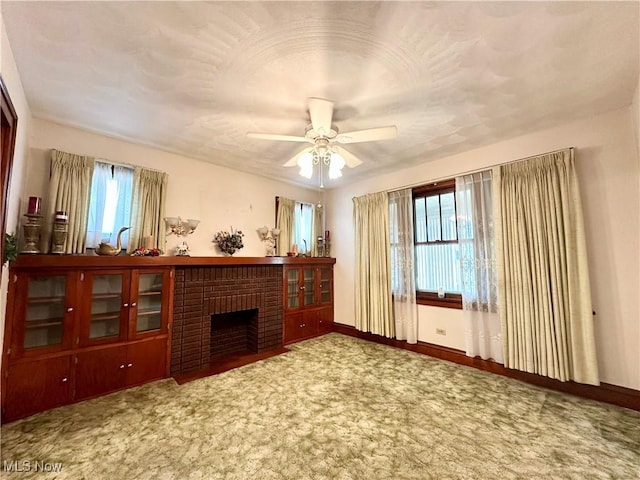 808 Gilbert Ave, Follansbee, WV 26037 - carpeted living room featuring ceiling fan, baseboards, and a fireplace