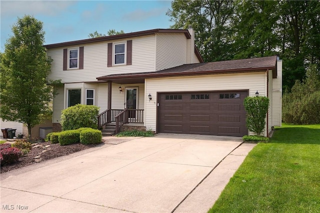 9201 Pleasant Lake Blvd, Parma, OH 44130 - traditional-style home featuring concrete driveway, a garage, and a front yard