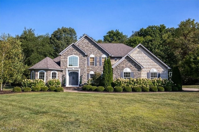 4679 Paxton Rd, Copley, OH 44321 - view of front of house featuring stone siding and a front yard