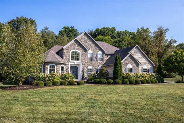 4679 Paxton Rd, Copley, OH 44321 - view of front facade featuring stone siding and a front yard
