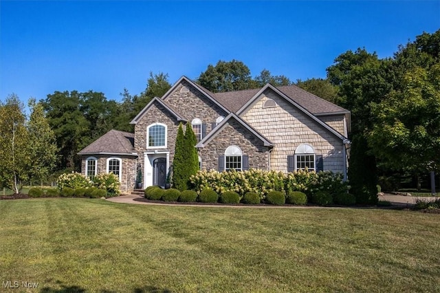 4679 Paxton Rd, Copley, OH 44321 - view of front of home with stone siding and a front lawn