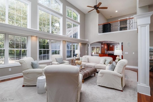 4679 Paxton Rd, Copley, OH 44321 - living area featuring a towering ceiling, ceiling fan, and wood finished floors