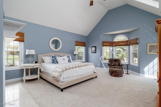 4679 Paxton Rd, Copley, OH 44321 - carpeted bedroom with multiple windows, high vaulted ceiling, and a ceiling fan