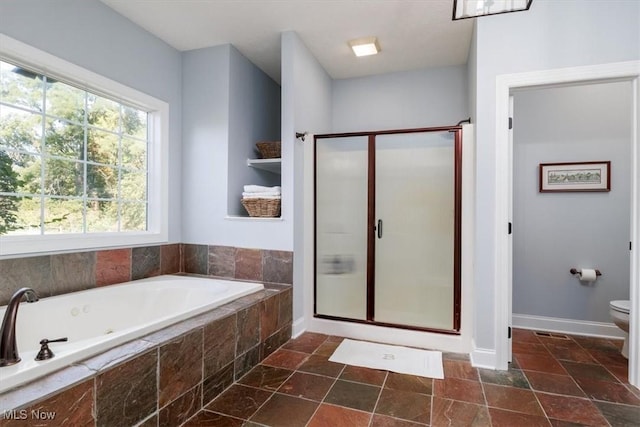 4679 Paxton Rd, Copley, OH 44321 - bathroom featuring a shower stall, a jetted tub, and stone tile flooring