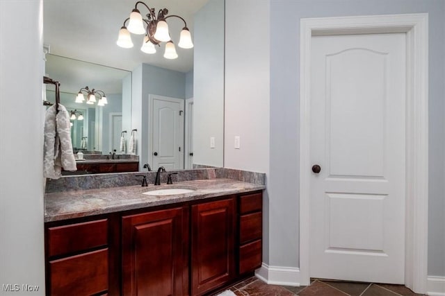 4679 Paxton Rd, Copley, OH 44321 - bathroom featuring a chandelier and vanity