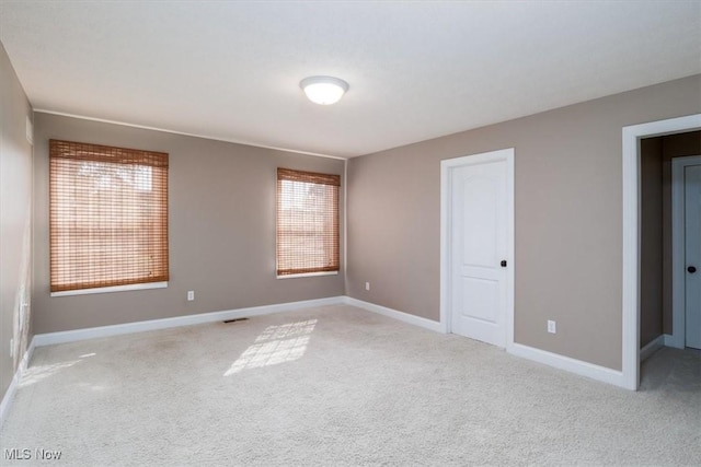 4679 Paxton Rd, Copley, OH 44321 - empty room featuring light colored carpet and plenty of natural light