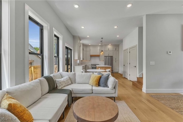 1904-2 E 123rd St, Cleveland, OH 44106 - living room with baseboards, light wood finished floors, and recessed lighting
