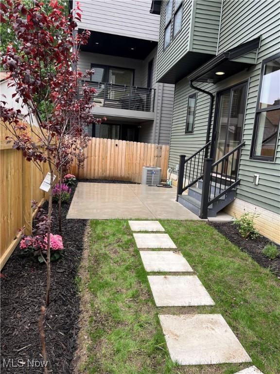 1904-2 E 123rd St, Cleveland, OH 44106 - view of yard featuring central AC unit and a patio area