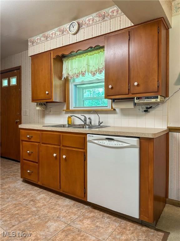 195 Fairlawn Ave, Niles, OH 44446 - kitchen with dishwasher, brown cabinetry, and light countertops