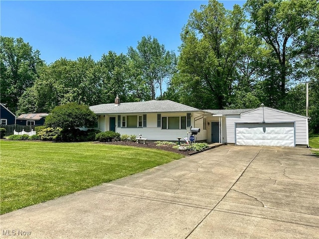 195 Fairlawn Ave, Niles, OH 44446 - view of front of house with a front yard, driveway, a garage, and a chimney