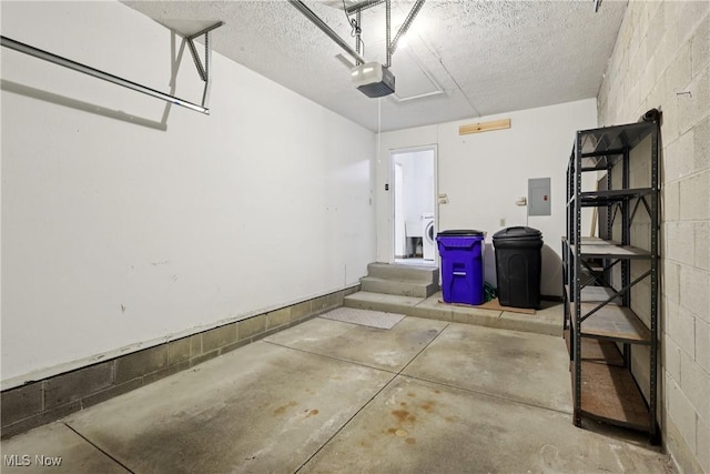 47 Tudor Ln Unit 6C, Kent, OH 44240 - garage featuring electric panel, concrete block wall, and a garage door opener